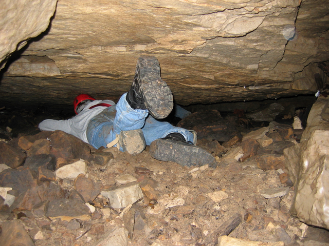 Photo of a low-ceilinged cave passage